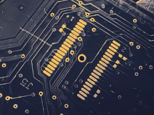 Close-up of a computer chip on a circuit board representing AI technology