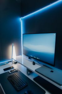 Modern desktop computer monitor and keyboard set up on a clean desk