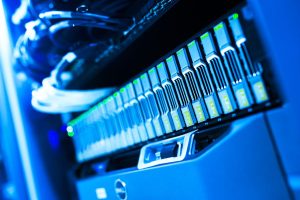 Close-up of illuminated blue server storage hardware representing cloud data sync technology