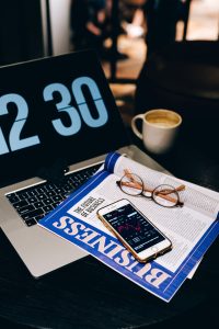 Laptop and smartphone on a desk representing an email marketing campaign workspace